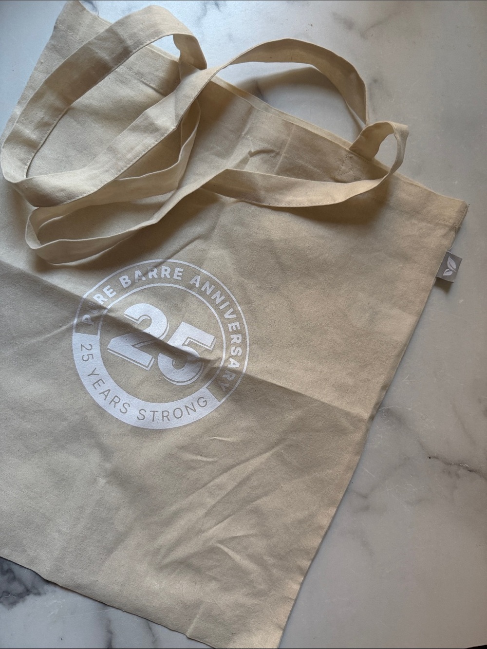 Canvas Tote Bag in Natural with 25th pure barre Anniversary Logo
15.6 x 14.5 “